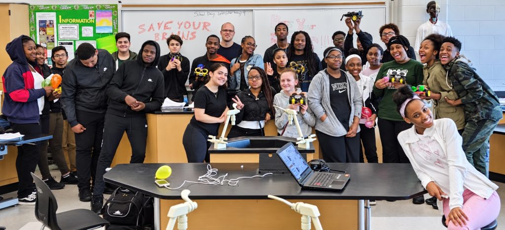 Students gathered around a classroom neuroscience experiment